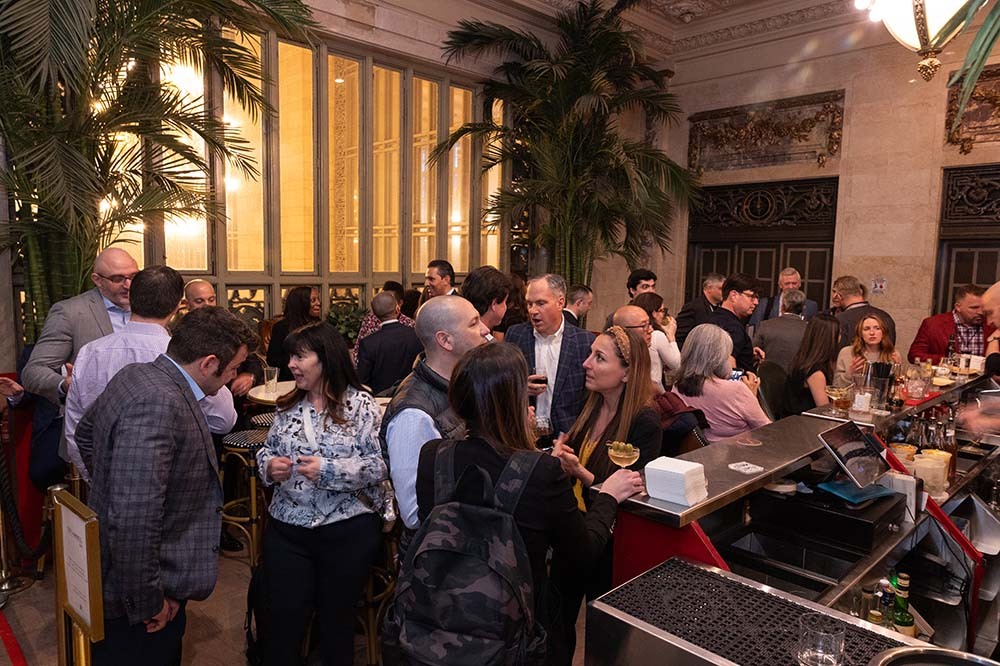 Photo of people talking in a hotel bar