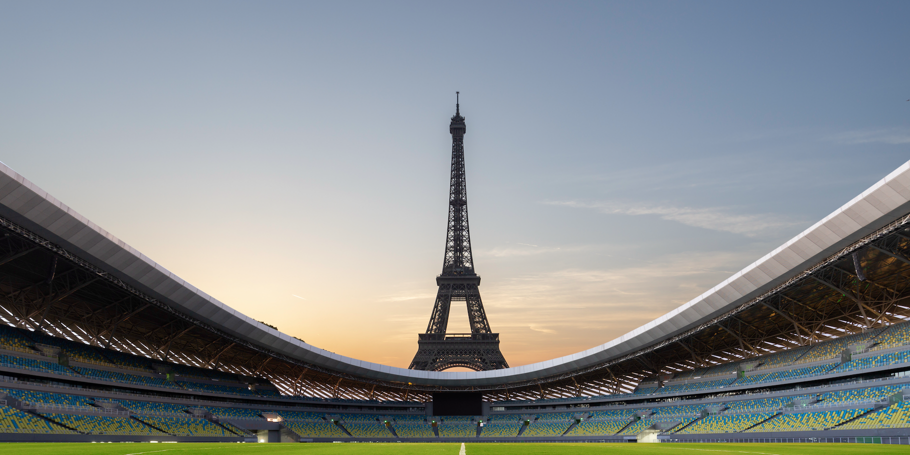 Seen from inside a stadium, the Eiffel Tower looms tall in the distance